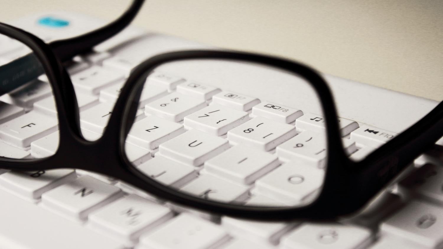 Glasses on a computer keyboard